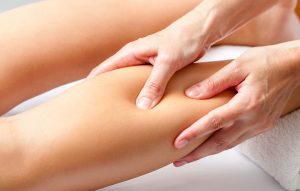 photo of woman receiving reflexology treatment